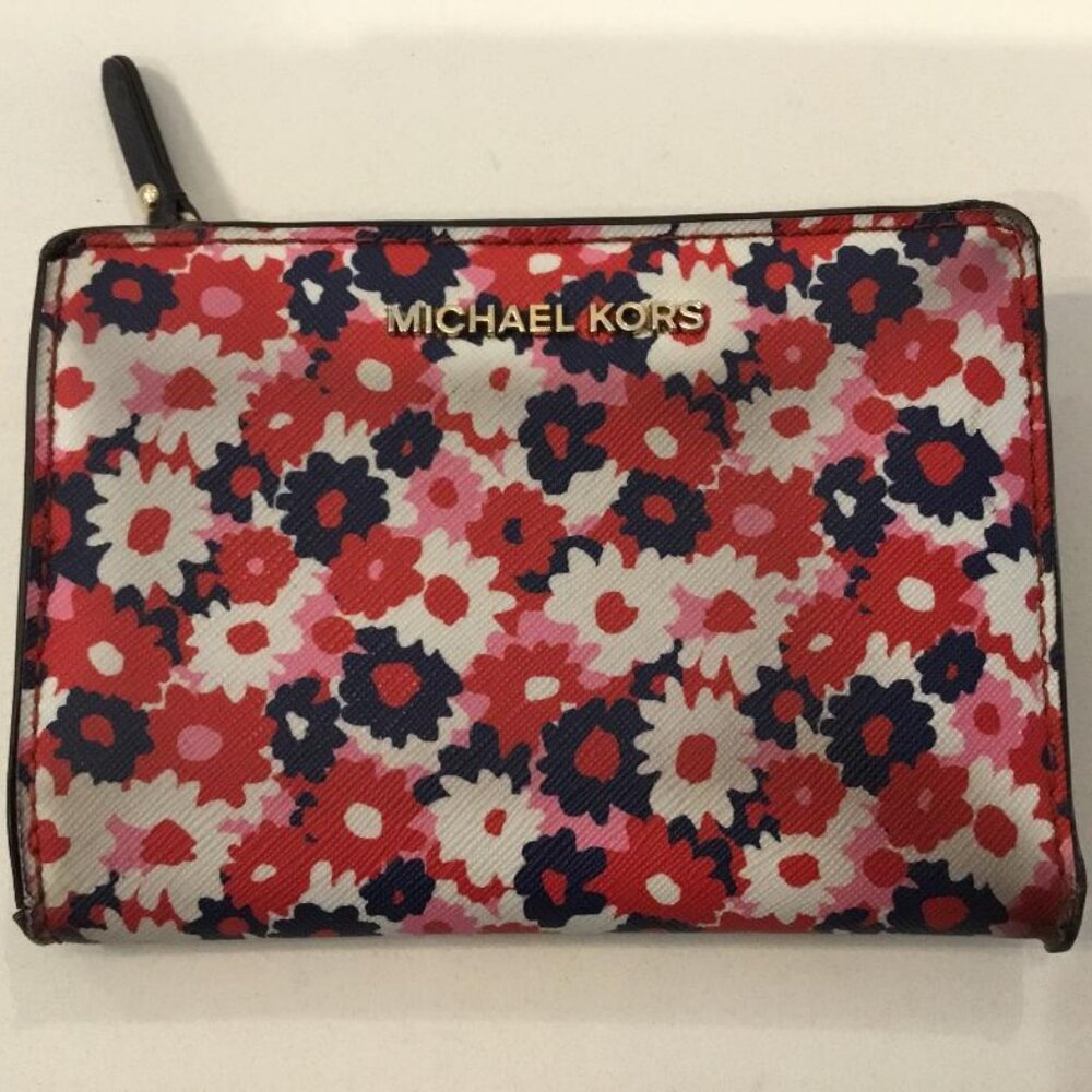 Michael Kors Medium Carnation Slim Wallet in a Begonia floral print.